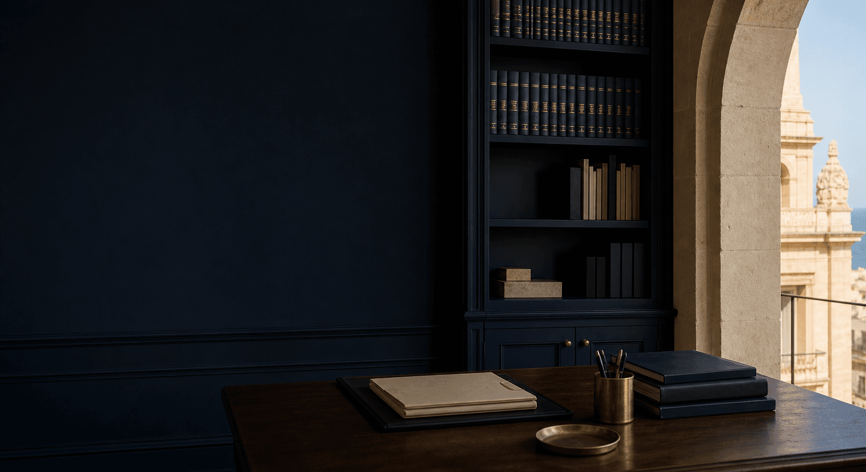 Unoccupied navy legal office with Maltese limestone architecture and a dark timber desk
