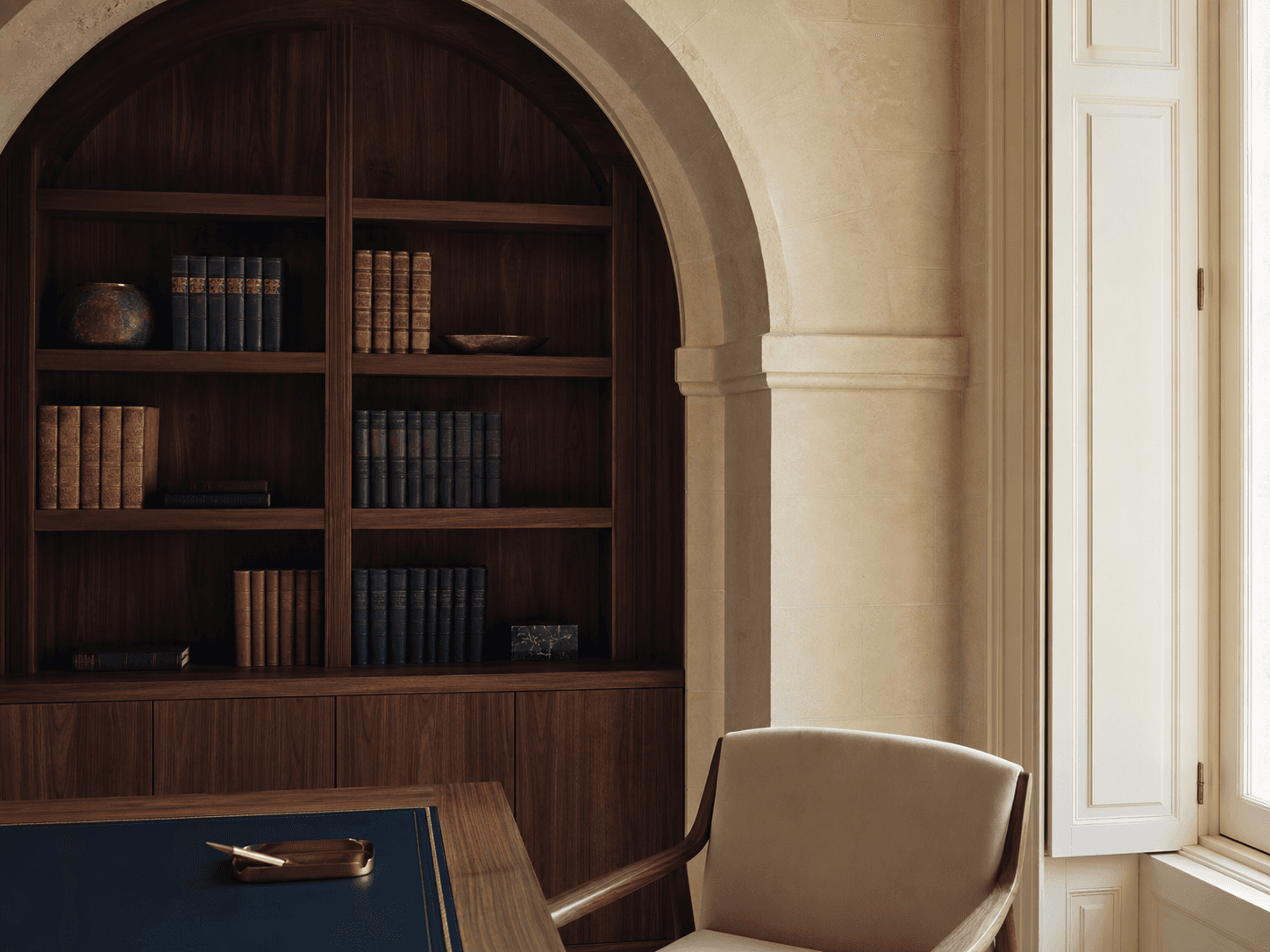 Limestone arch and timber library in an unoccupied Maltese office